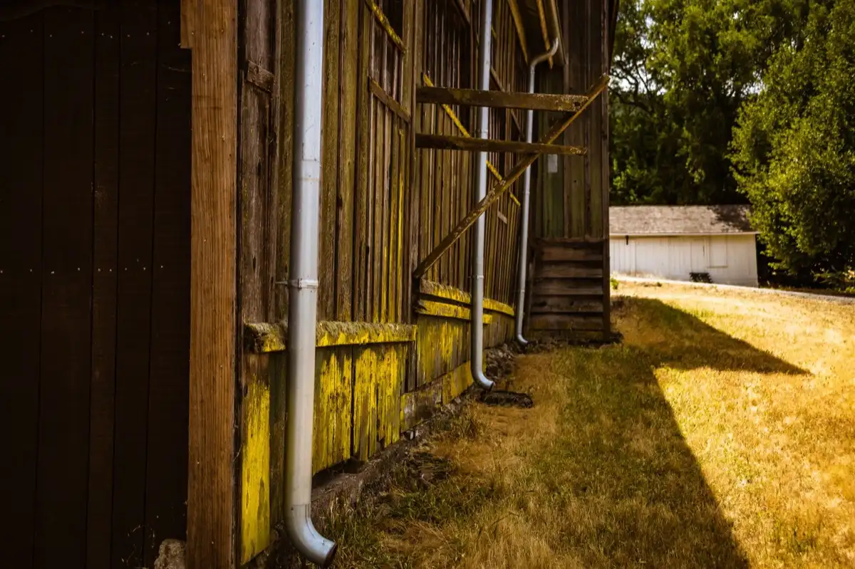 Downspout discharging beside a foundation wall on a house in North Port, FL